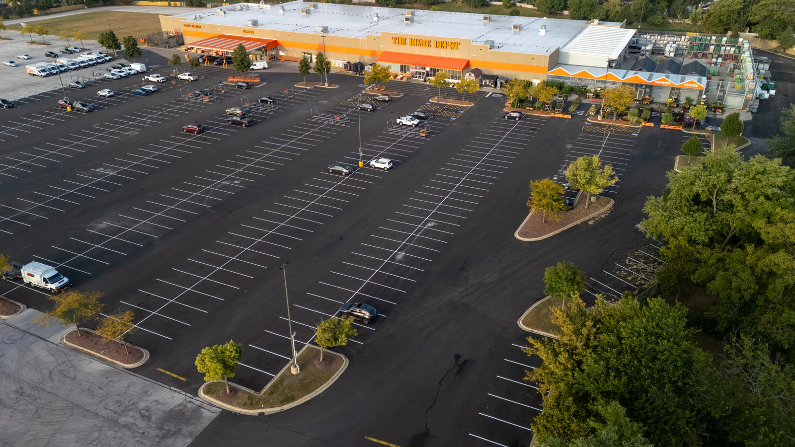 Aerial view of a freshly paved and striped Home Depot parking lot by Advantage Paving